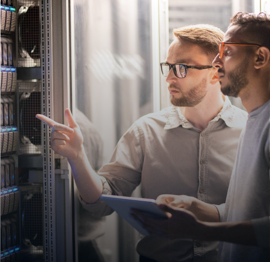 IT specialists reviewing server infrastructure